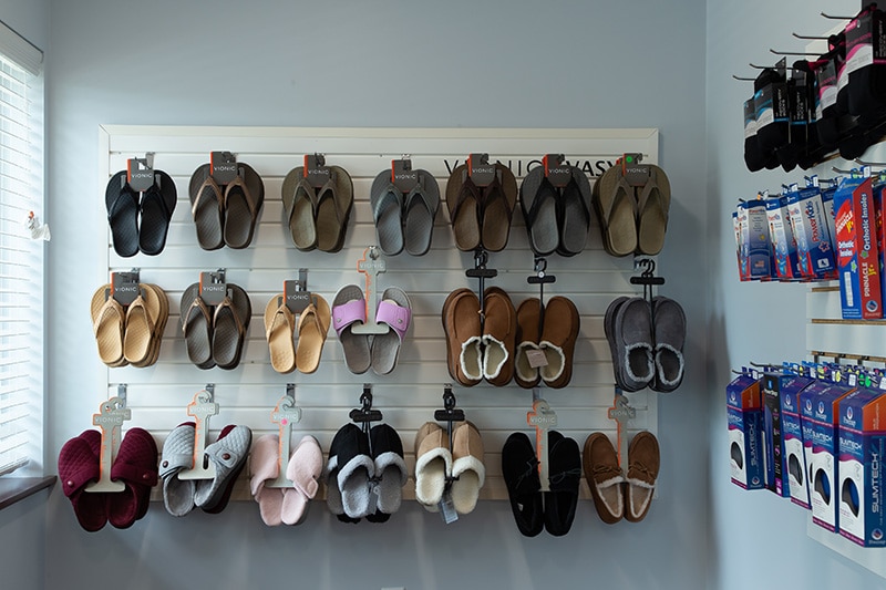 Wall of sandals and slippers available for purchase