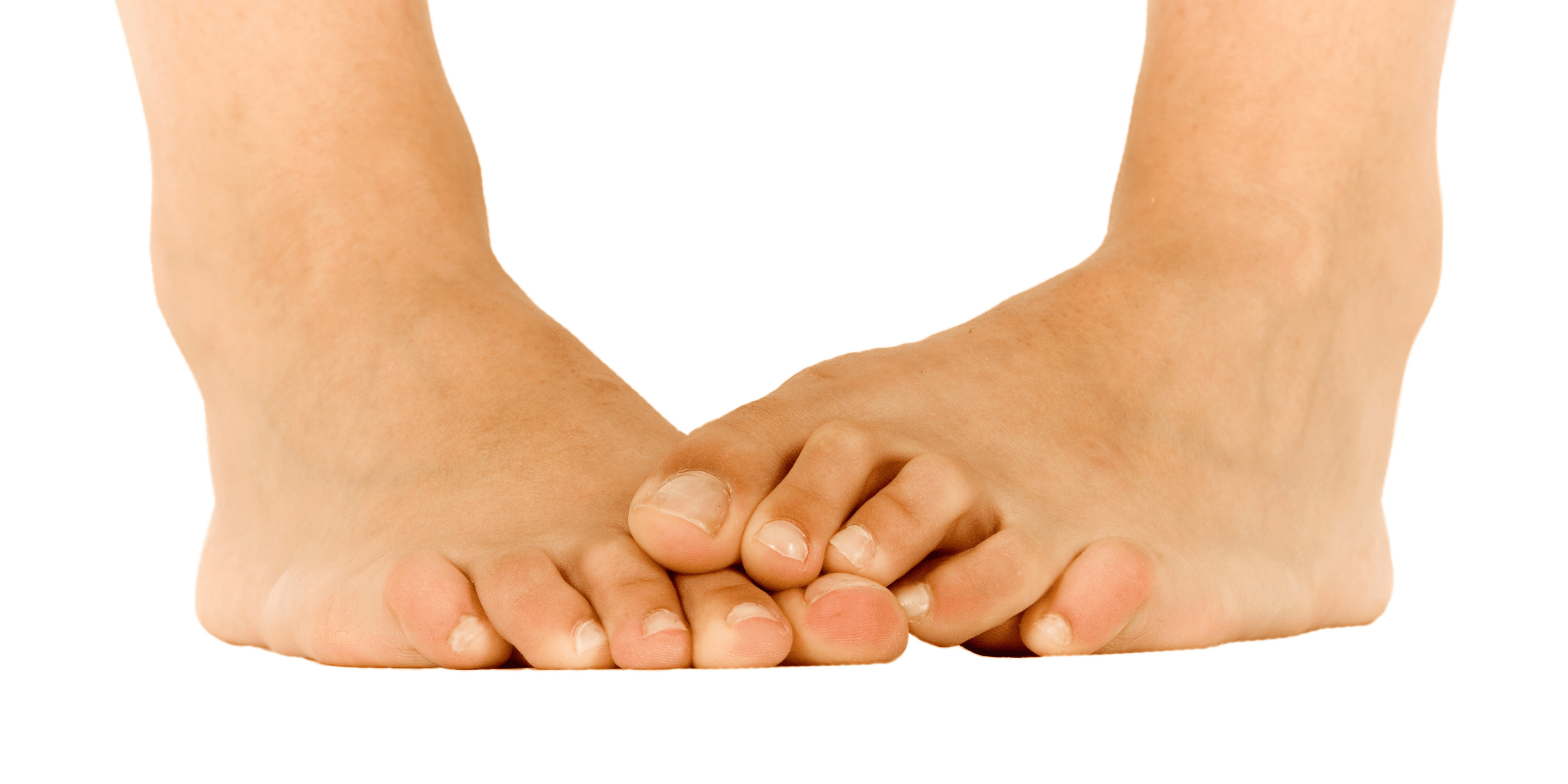 Feet on top of each other on white background
